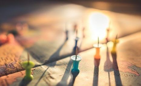 close-up-photo-of-assorted-color-of-push-pins-on-map-1078850